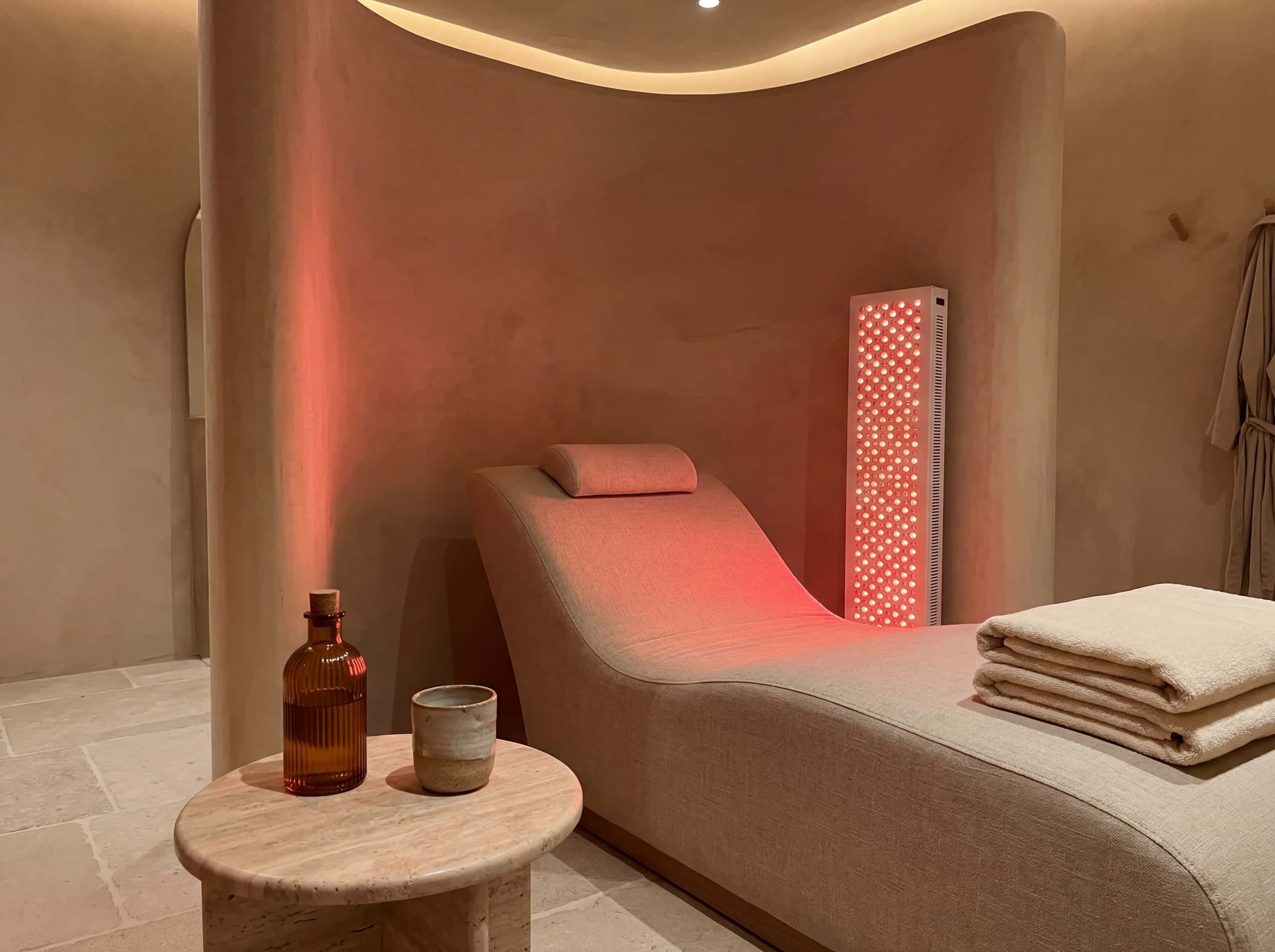 Red light therapy room with warm panel glow